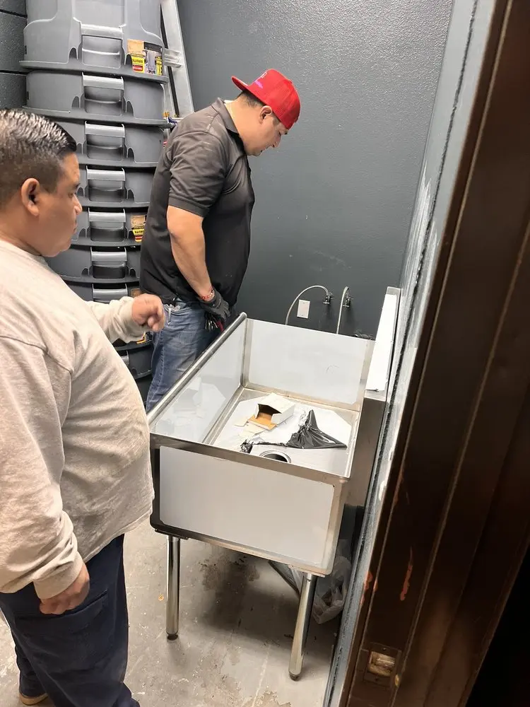Commercial plumbing and sink installation in Genoa